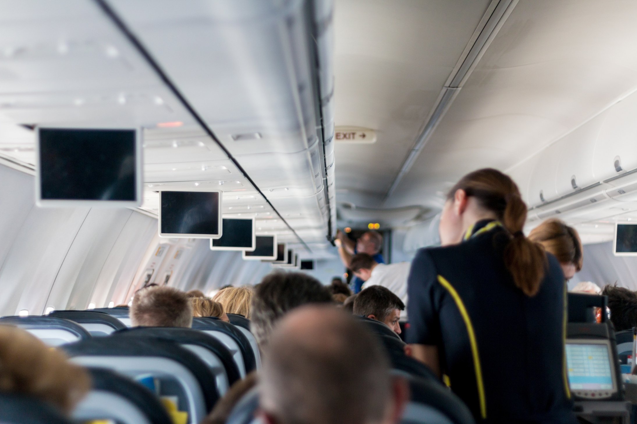 Stewardess Helping Passengers